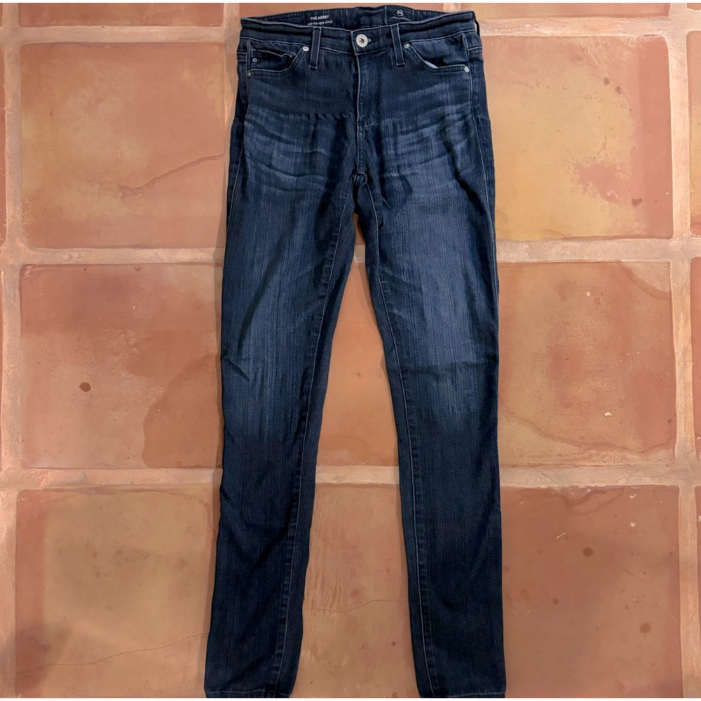 AG Size 25 the abbey mid rise super skinny jean in dark denim.